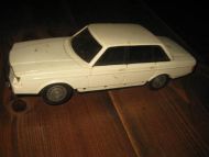 Finsk VOLVO 240GL, plast, ca 24 cm lang, mangler et av bakhjula. Elles i grei stand. 60 tallet.