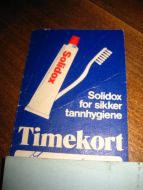 Timekort med tannlege, reklame for Solidox, 80 tallet