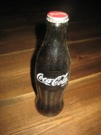 Uåpna flaske Coca Cola fra 70 tallet??. 19 cm høg. 237 ml..